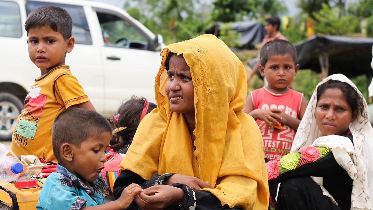 A Rohingya family outside the Balukhali camp in Ukhia on Wednesday. Photo: Abdus Salam