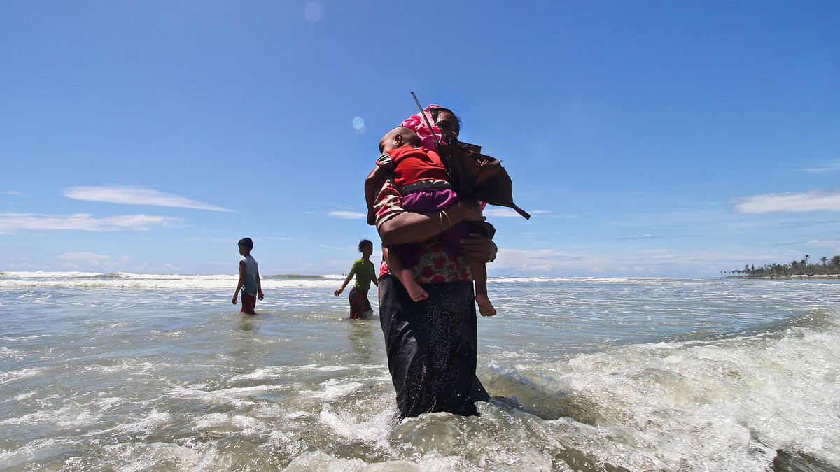 This Rohingya woman came by sea to Bangladesh with her child,  risking her life. Picture taken Thursday. Photo: Abdus Salam