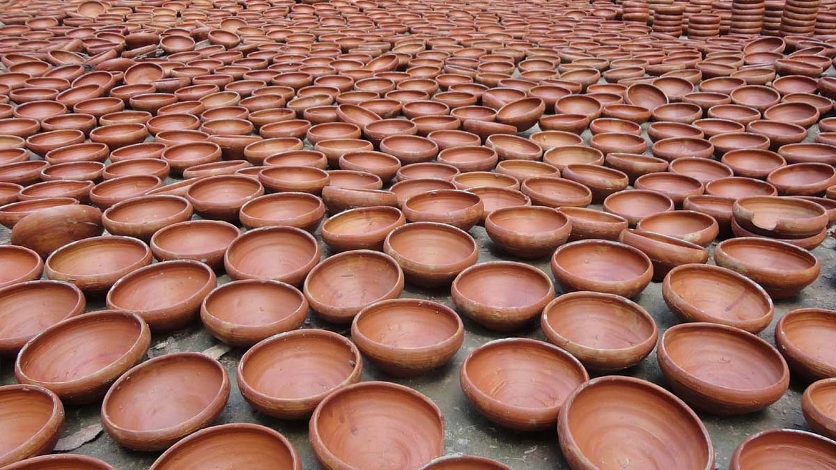 These earthen pots used to store card and Kheer. They are being dried in the sun after colouring. The picture was taken from Palpara village of Pirojpur. Photo: AKM Faisal