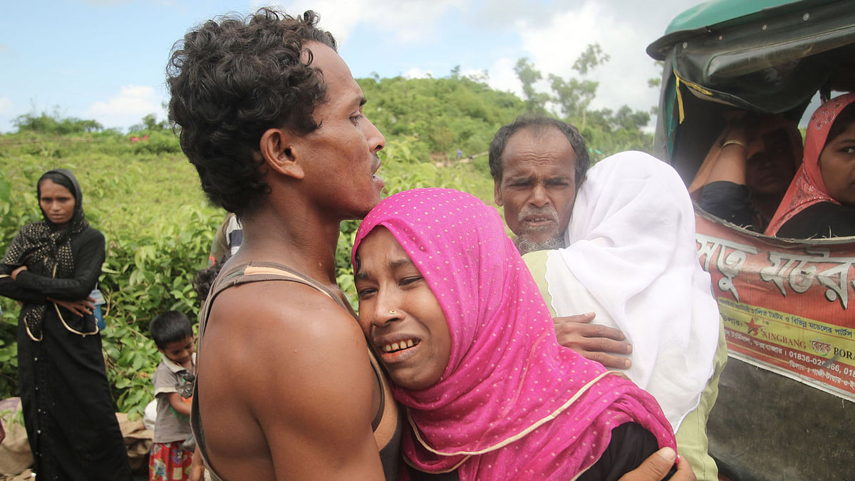 Two refugees of a Rohingya family fleeing persecution in Myanmar have emotional reunion recently with other family members in a refugee camp of Ukhia, Cox`s Bazar. Photo: Abdus Salam