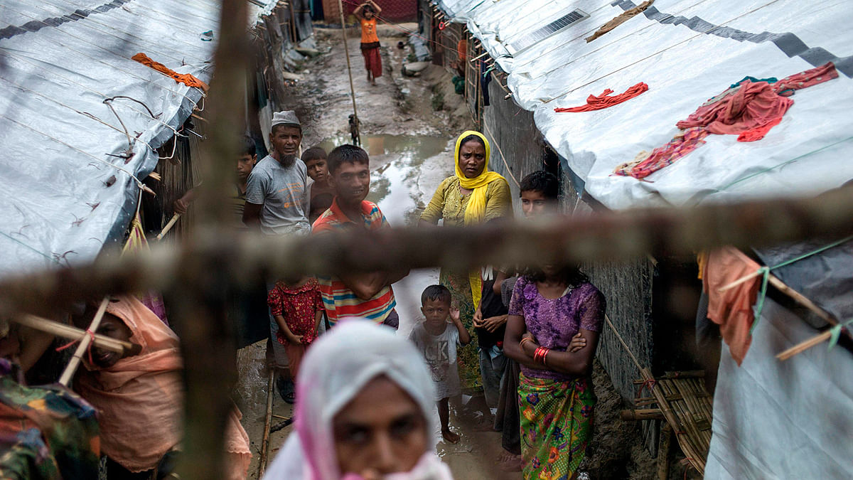 Rohingya Muslim refugees stand in an alley of Kutupalong refugee camp in the Bangaldeshi district of Ukhia on 28 September, 2017. Photo: AFP