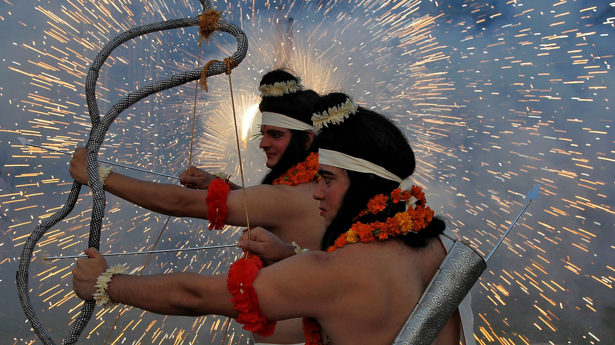 Artistes dressed as Hindu gods Rama and Laxman act as fireworks explode during Vijaya Dashmi, or Dussehra festival celebrations in Chandigarh, India, 30 September 2017.  Photo: Reuters