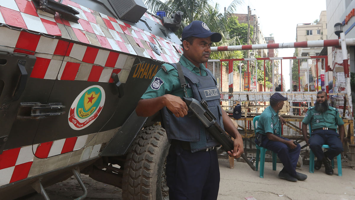 Policemen stand guard to the National Buddhist Monastery in Badda, Dhaka as security around different Buddhist temples of the country were beefed up following atrocities on the Rohingyas in Myanmar. Photo: Abdus Salam