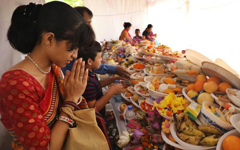 Devotees with their offerings arrive at a Pagoda at Nandan Kanan, Chittagong to celebrate Prabarana Purnima, a Buddhist festival, on Thursday. Photo: Sourav Das