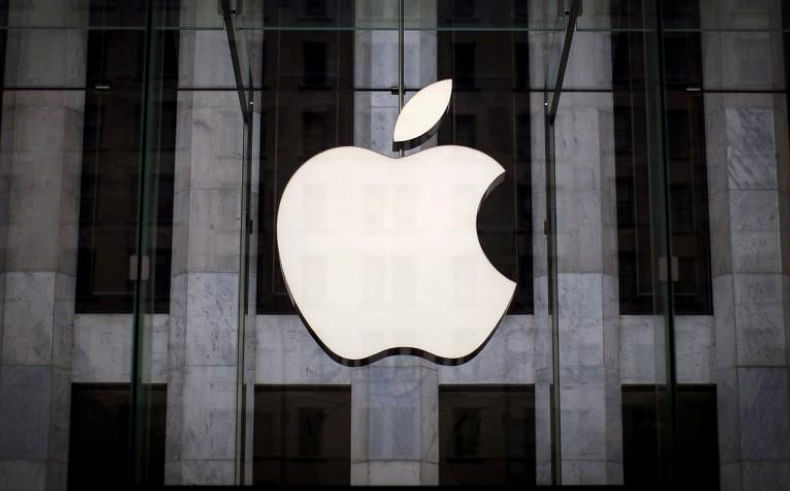 An Apple logo hangs above the entrance to the Apple store on 5th Avenue in the Manhattan borough of New York City, on 21 July 2015. -- Reuters
