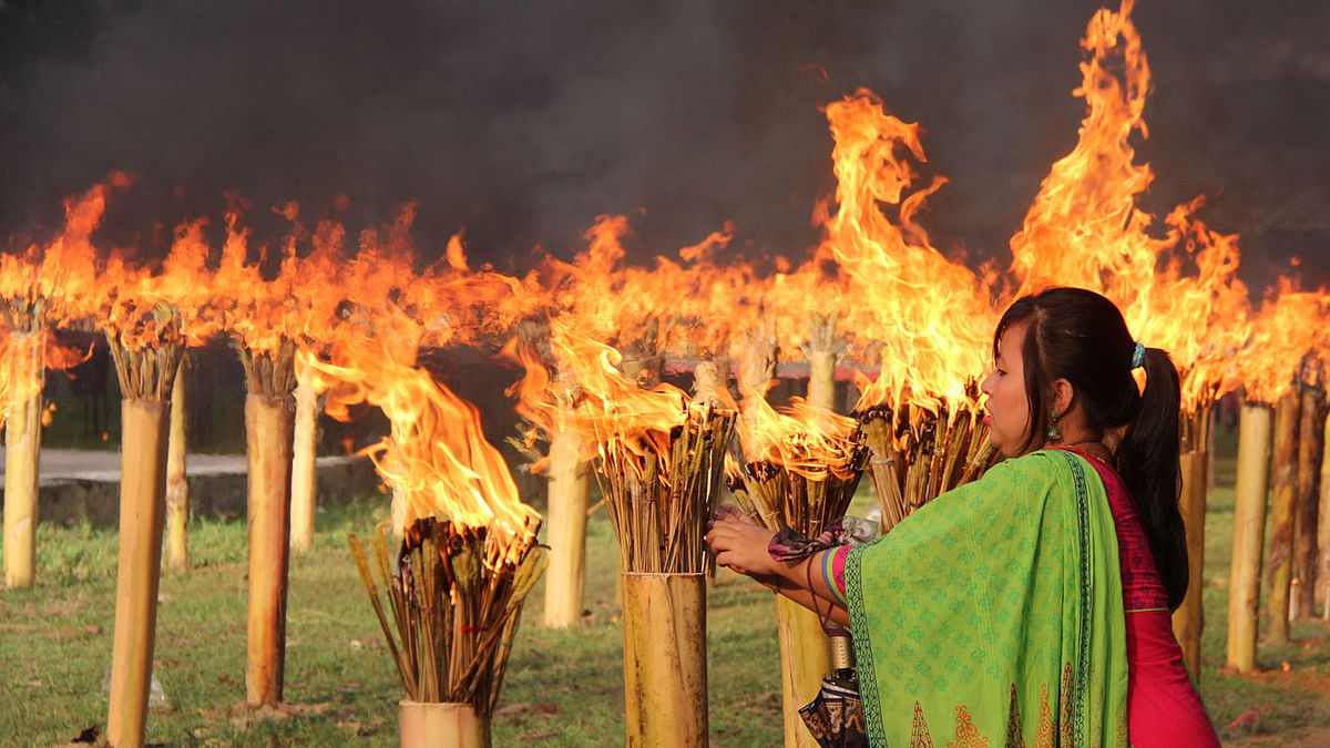 Buddhist rituals being performed for Probarona Purnima in Khagrachhari, with 84 thousand sticks set aflame. 6 October, Dharmapur Aryaban temple, Khagrachhari. Photo: Nirob Chowdhury