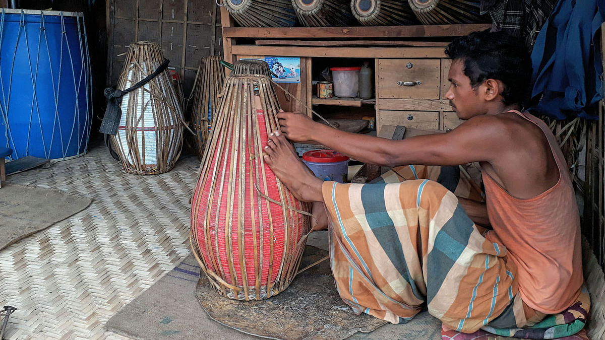 Preparations are on for the Hindu festival of religious songs, kirtan. Traditonal drums, `dhak` and `dhol`, are being made and repaired for the ccasion. 5 October, Chandaikona Bazar, Raiganj, Sirajganj. Photo: Sajedul Alam