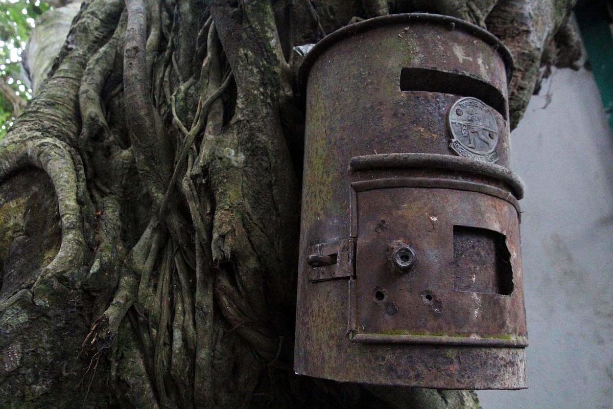 An unused post box is kept hanging from a tree of Bhawal, Faridpur. Photo: Alimuzzaman