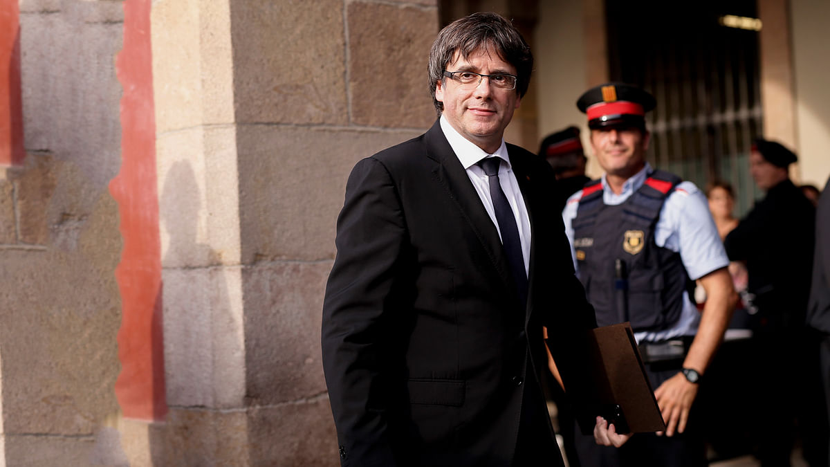 Catalan regional government president Carles Puigdemont arrives to address the Catalan regional parliament in Barcelona on 10 October, 2017. Photo: AFP