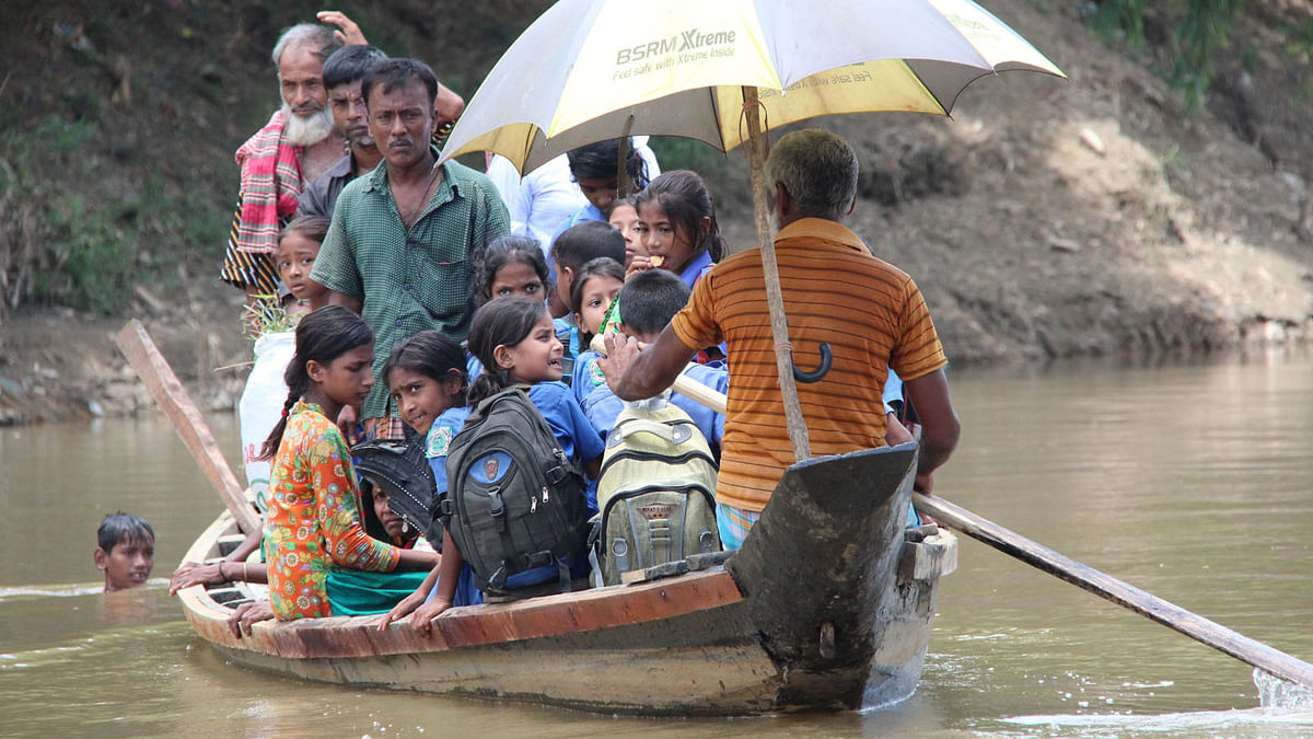 Hundreds of children cross the river Chengi to go to school every day. In the monsoons when the river current is strong, they can’t attend school regularly. 10 October, Arambagh, Khagrachhari. Photo: Nirab Chowdhury