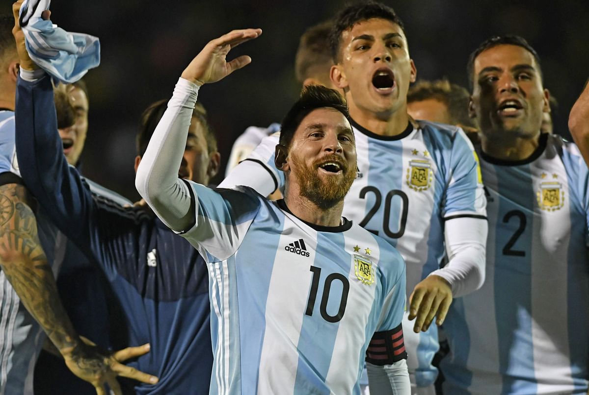 Argentina`s Lionel Messi (C) celebrates after defeating Ecuador and qualifying to the 2018 World Cup football tournament, in Quito, on October 10, 2017. AFP