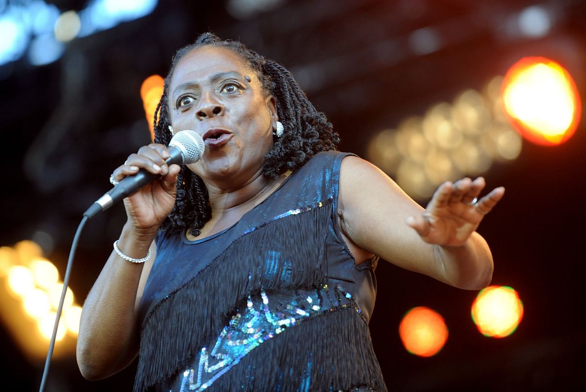 This file photo taken on 25 May, 2012 shows US singer Sharon Jones performing with her band, 'Sharon Jones and the Dap-Kings' on the of the Art Rock Festival in Saint-Brieuc, western France. An album of unreleased songs by soul singer Sharon Jones will come out next month one year after her death, her label announced on 10 October, 2017. Photo: AFP