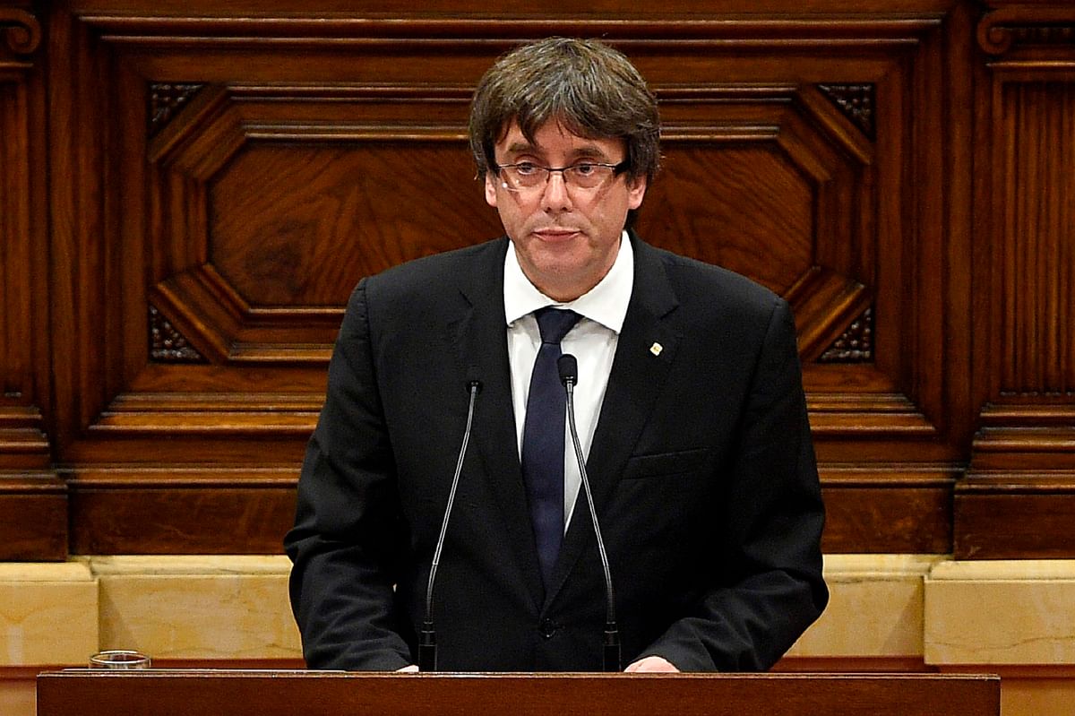 Catalan regional government president Carles Puigdemont gives a speech at the Catalan regional parliament in Barcelona on 10 October, 2017. Photo: AFP