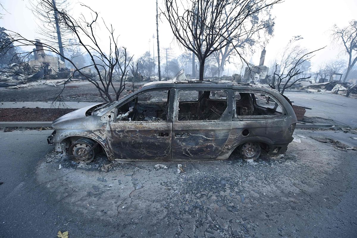 A car destroyed by wildfires is seen in Santa Rosa, California, on October 11, 2017. AFP