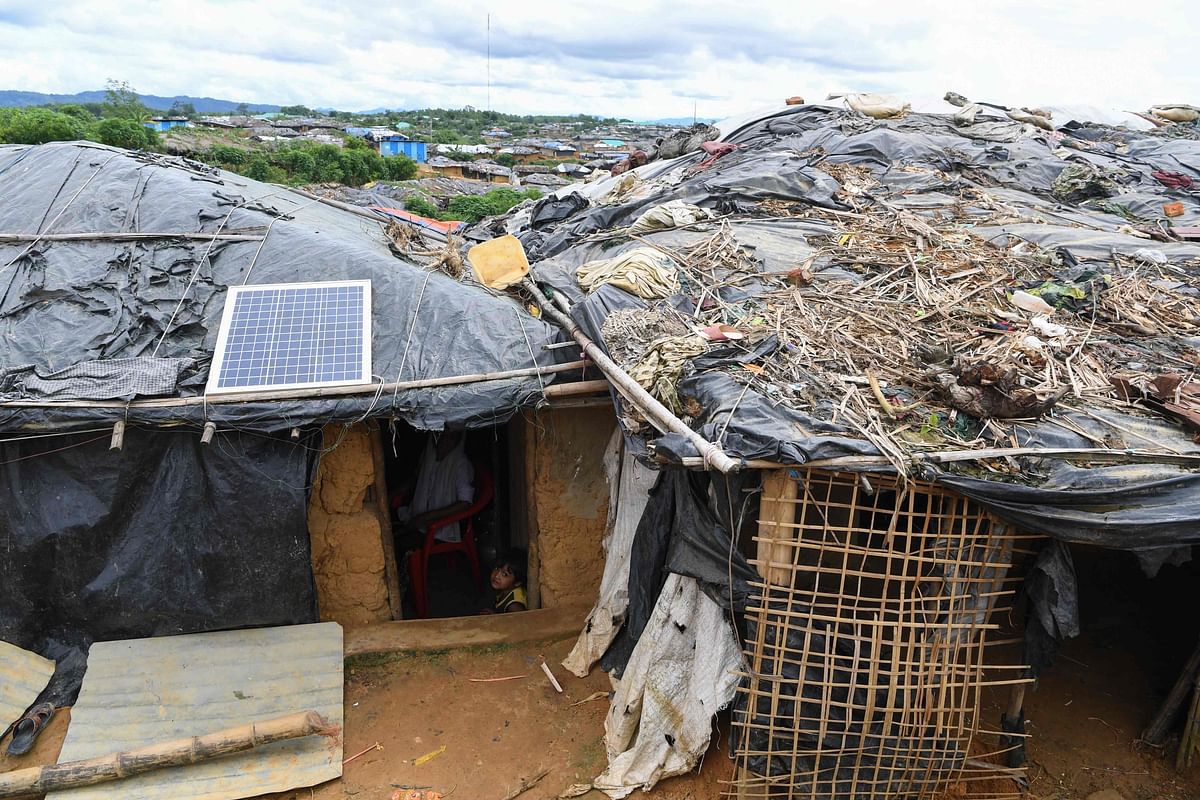 This photo taken on October 7, 2017 shows a solar panel on the roof of a temporary home for Rohingya refugees at the Kutupalong refugee camp in Cox`s Bazar. AFP