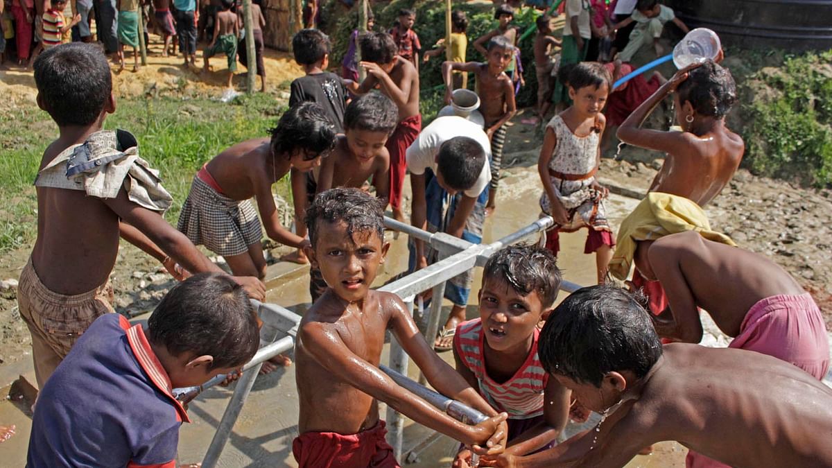 The Rohingya children are busy taking bath in Putibunia area of Teknaf in Cox’s Bazaar on 27 October 2017. Photo: Jewel Shil