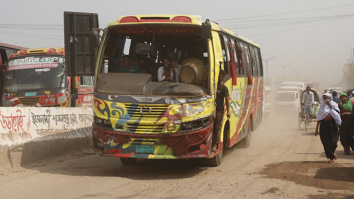 The bus without windshield travels on the highway. Such fitness buses frequently travel in Jatrabari area of Dhaka on 28 October 2017. Photo: Hasan Raja