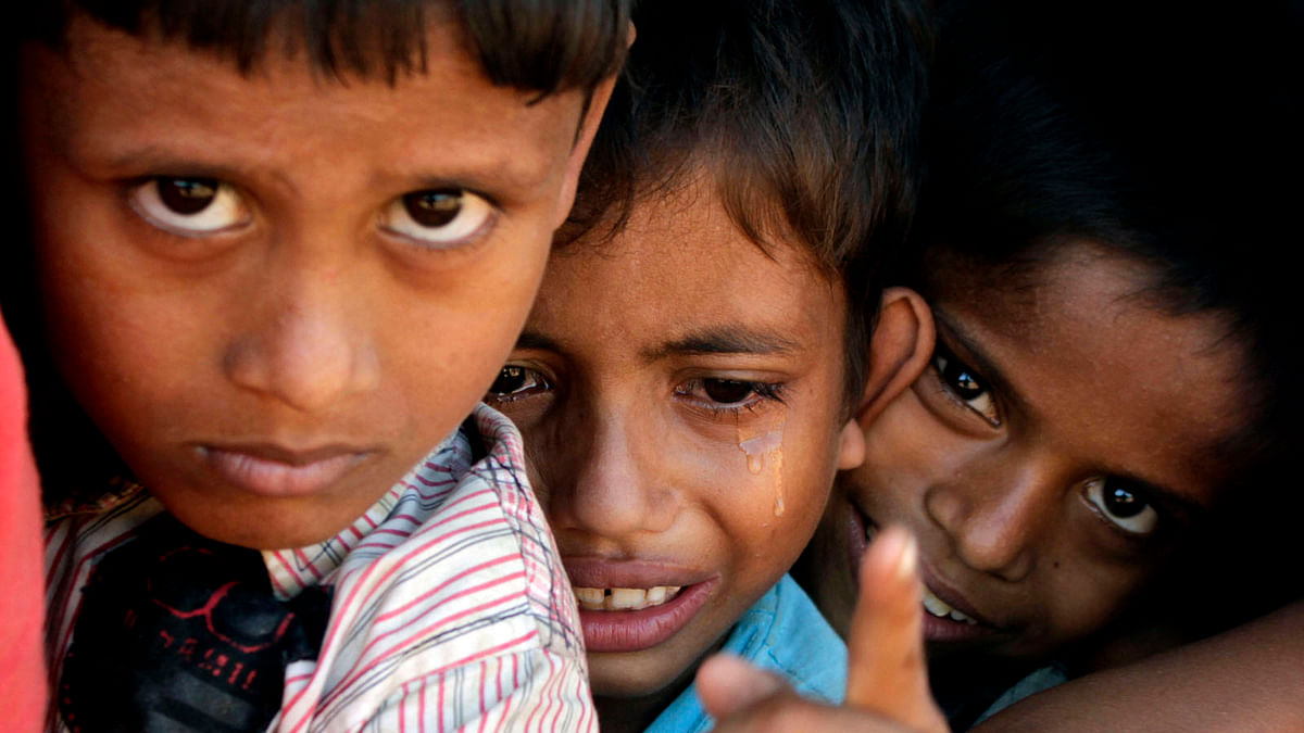 The Rohingya children are waiting for food in Putbania of Teknaf in Cox’s Bazaar on 27 October 2017. Photo: Jewel Shil