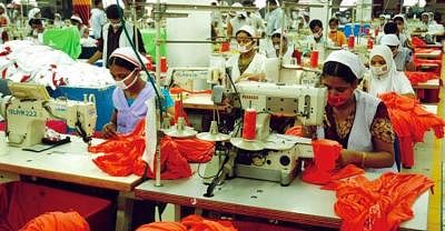 Workers at a factory. File Photo