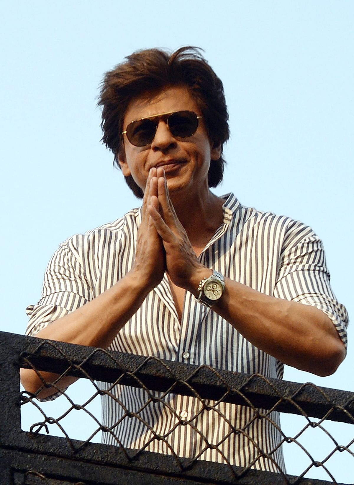 Indian Bollywood actor Shah Rukh Khan waves to fans during celebrations for his 52nd birthday at his home in Mumbai on 2 November, 2017. Photo: AFP