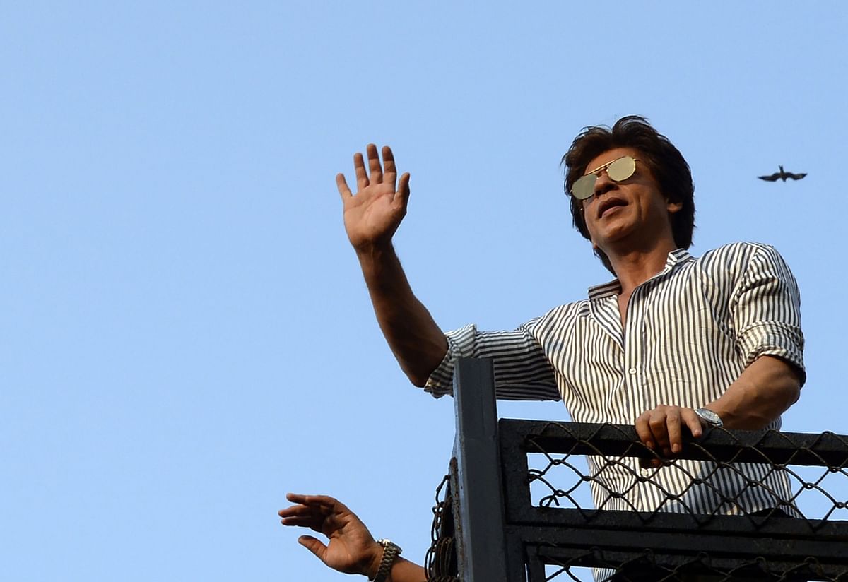 Indian Bollywood actor Shah Rukh Khan waves to fans during celebrations for his 52nd birthday at his home in Mumbai on 2 November, 2017. Photo: AFP