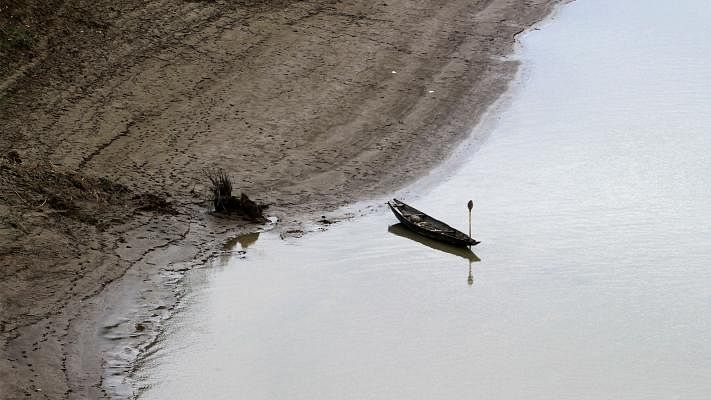 The river Surma is nearly dry in the winter. A boat abandoned on the river bank at Tuker Bazar, Sylhet. 18 November. Photo: Anis Mahmud