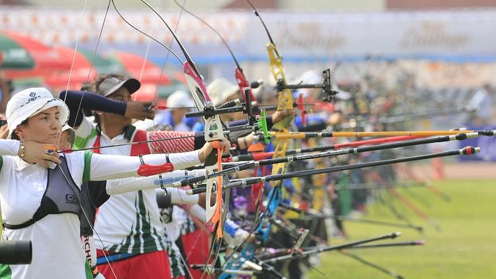 Archers from different countries of the world practise in a winter evening at Bangabandhu National Stadium. 35 countries are participating in the Asian Archery Championship at Dhaka. 25 November. Photo: Hasan Raja