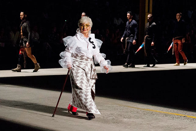 A elderly woman models a creation by Colombian designer Guio Di Colombia during the Walkway Inclusion fashion show in Cali, Colombia on November 29, 2017. Photo: AFP