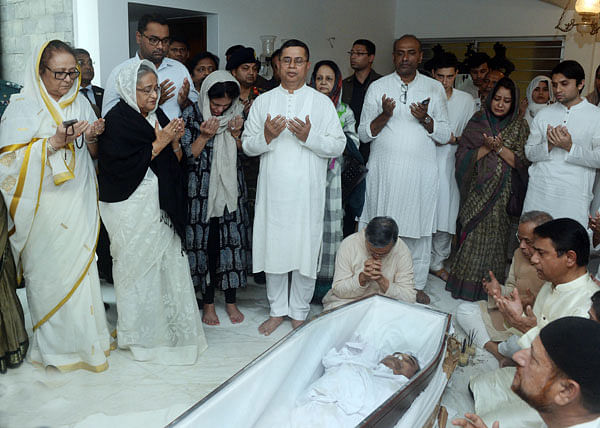 Prime minister Sheikh Hasina offers prayers near the body of Annisul Huq. Photo: Focus Bangla