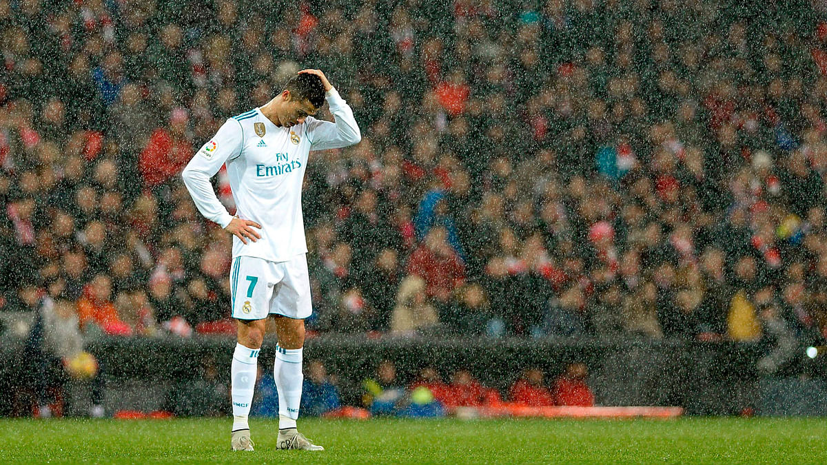 Real Madrid`s Portuguese forward Cristiano Ronaldo reacts as snow falls during the Spanish league football match Athletic Club Bilbao vs Real Madrid CF at the San Mames stadium in Bilbao on Saturday. Photo: AFP