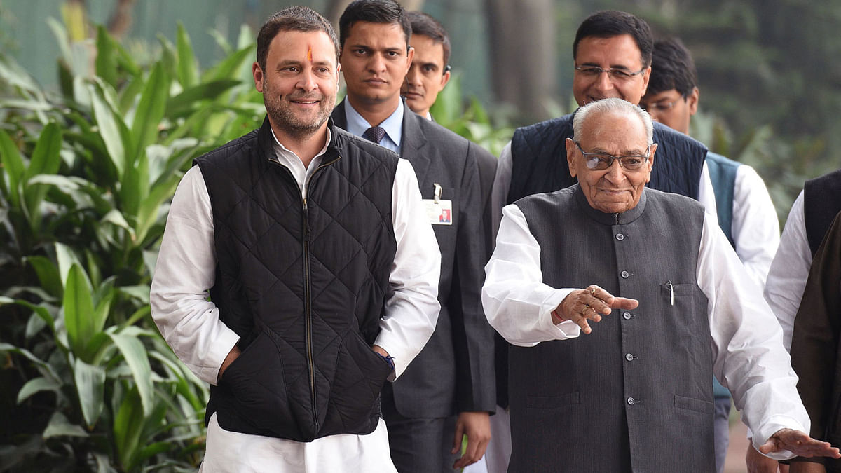 Indian Congress Party vice president Rahul Gandhi (L) walks with party leader Motilal Vora as he arrives to file his nomination papers for the post of party president at the All India Congress Committee office in New Delhi on Monday. AFP