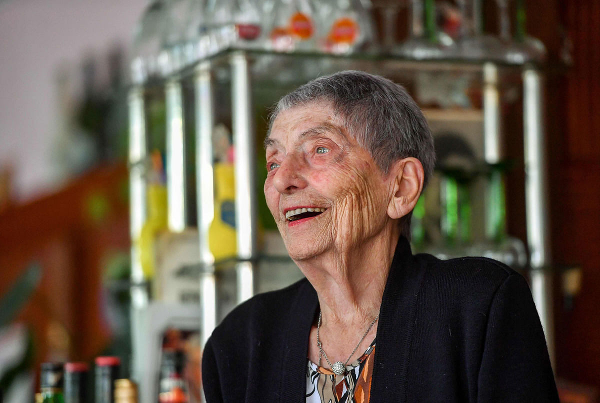Marie-Louise Wirth, a 100-year-old bar owner poses, on November 28, 2017 in Isbergues, in the very same bar where she started her professional life, at the age of 14. AFP
