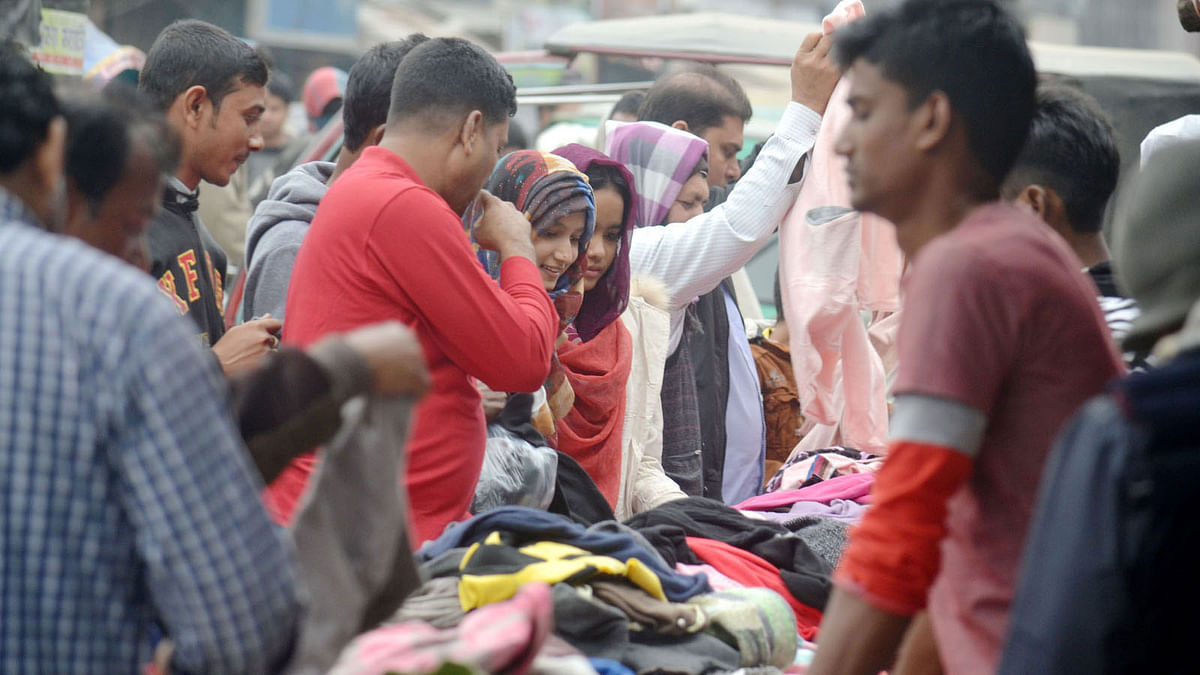 People buying winter clothes at Abdul Hamid Road in Pabna town on 20 December 2017. Photo: Hasan Mahmud