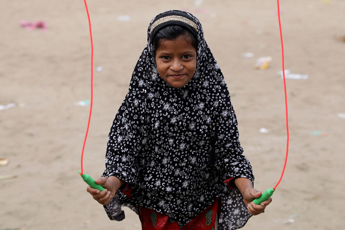 A Bangladeshi girl plays with a skipping rope in Dhaka. Photo: Reuters