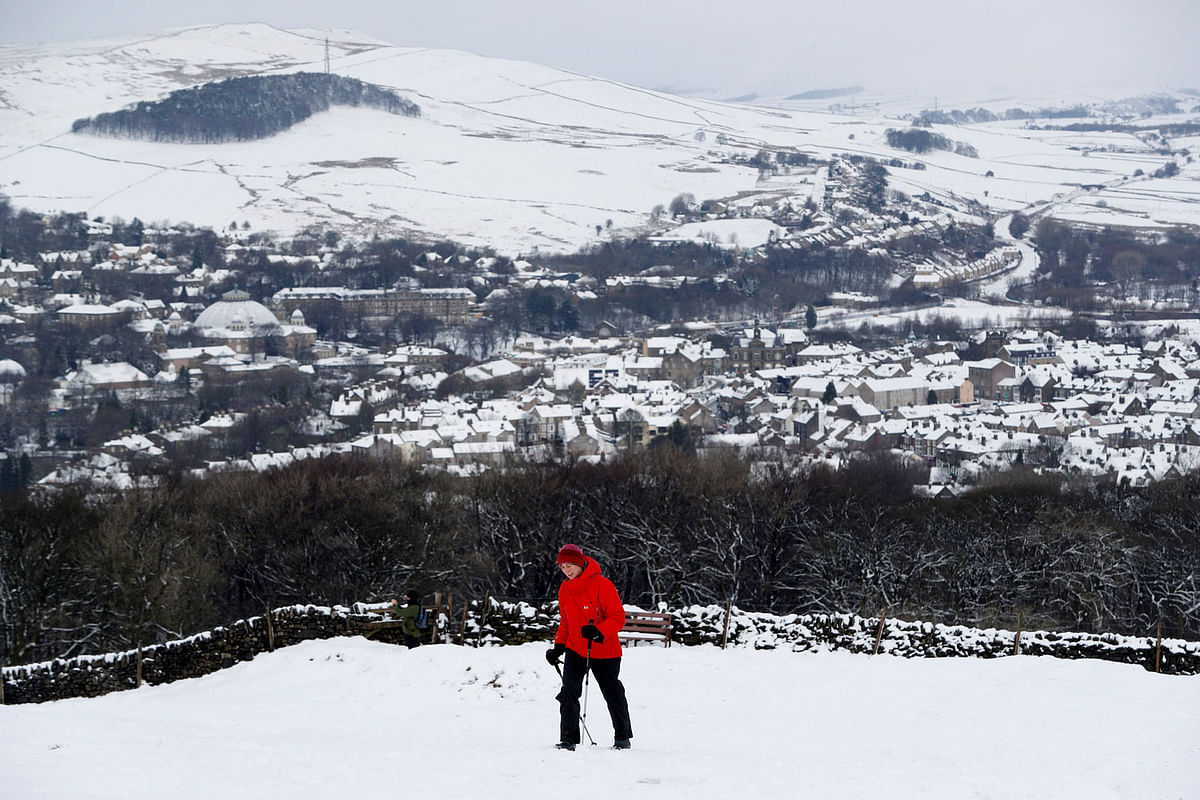 A walker treks towards Solomon`s Temple after snow fall in Buxton A walker treks towards Solomon`s Temple after snow fall in Buxton, Britain on 29 December 2017. Photo: Reuters