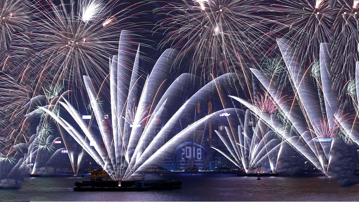 Fireworks explode over Victoria Harbour and Hong Kong Convention and Exhibition Centre during a pyrotechnic show to celebrate the New Year in Hong Kong, China on 1 January 2018. Photo: Reuters