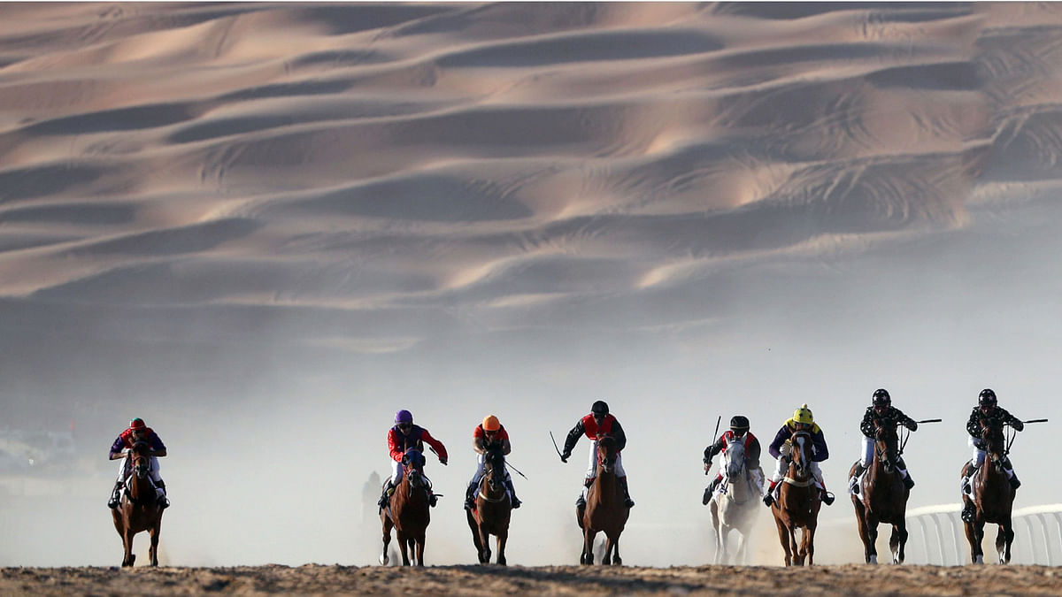 Jockeys compete in a race for purebred Arab horses during the Liwa 2018 Moreeb Dune Festival on 1 January 2018, in the Liwa desert, some 250 kilometres west of the Gulf emirate of Abu Dhabi. Photo: AFP