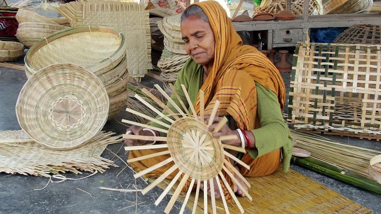 A sexagenarian is busy making bamboo products at Betagi in Gangachara upazila of Rangpur. Like Sudharani, who is here in the picture, many earn their livelihood by selling bamboo products. The photo was taken on 2 January. Photo: Moinul Islam