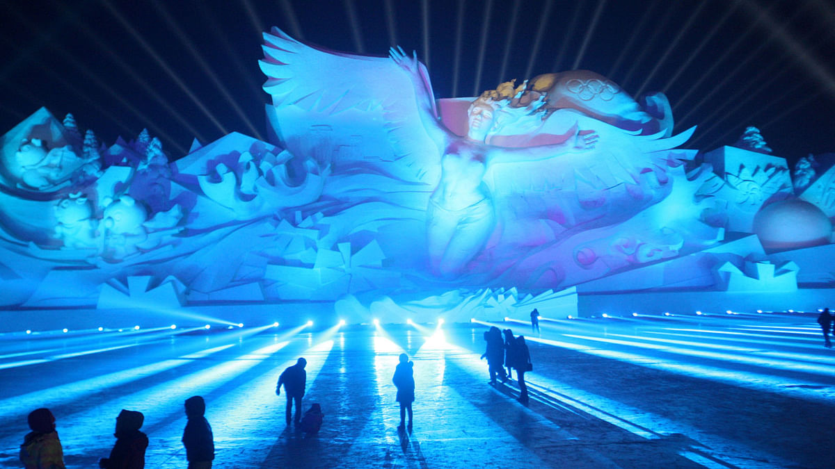 Visitors attend a 3D light show at the Harbin Sun Island International Snow Sculpture Art Expo in Harbin, Heilongjiang province, China on 1 January. Photo: Reuters