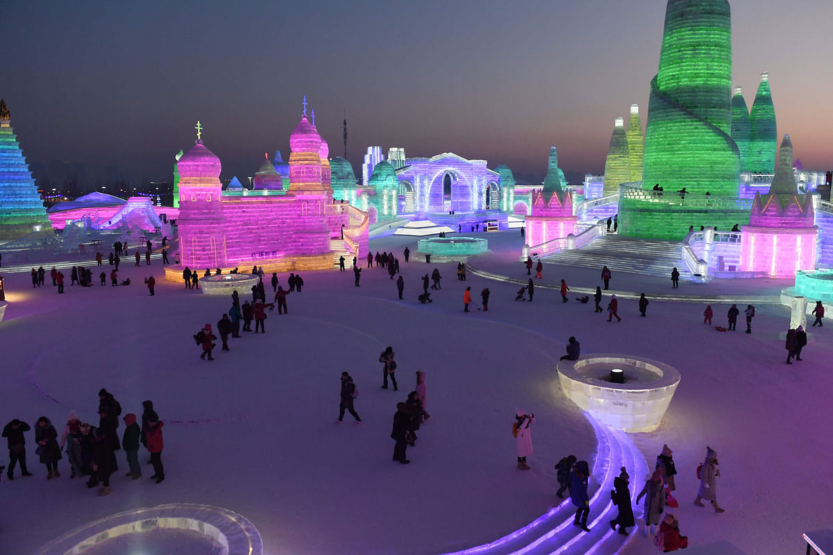 People visit the Harbin Ice and Snow World, part of the annual Harbin Ice and Snow Sculpture Festival in Harbin in China`s northeast Heilongjiang province on 4 January 2018. Photo: AFP