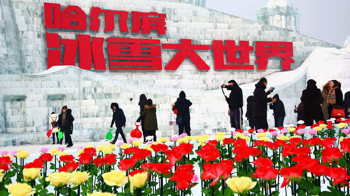 This photo taken on 2 January 2018 shows people visiting the Harbin Ice-Snow World in Harbin in China`s northeastern Heilongjiang province. Photo: AFP