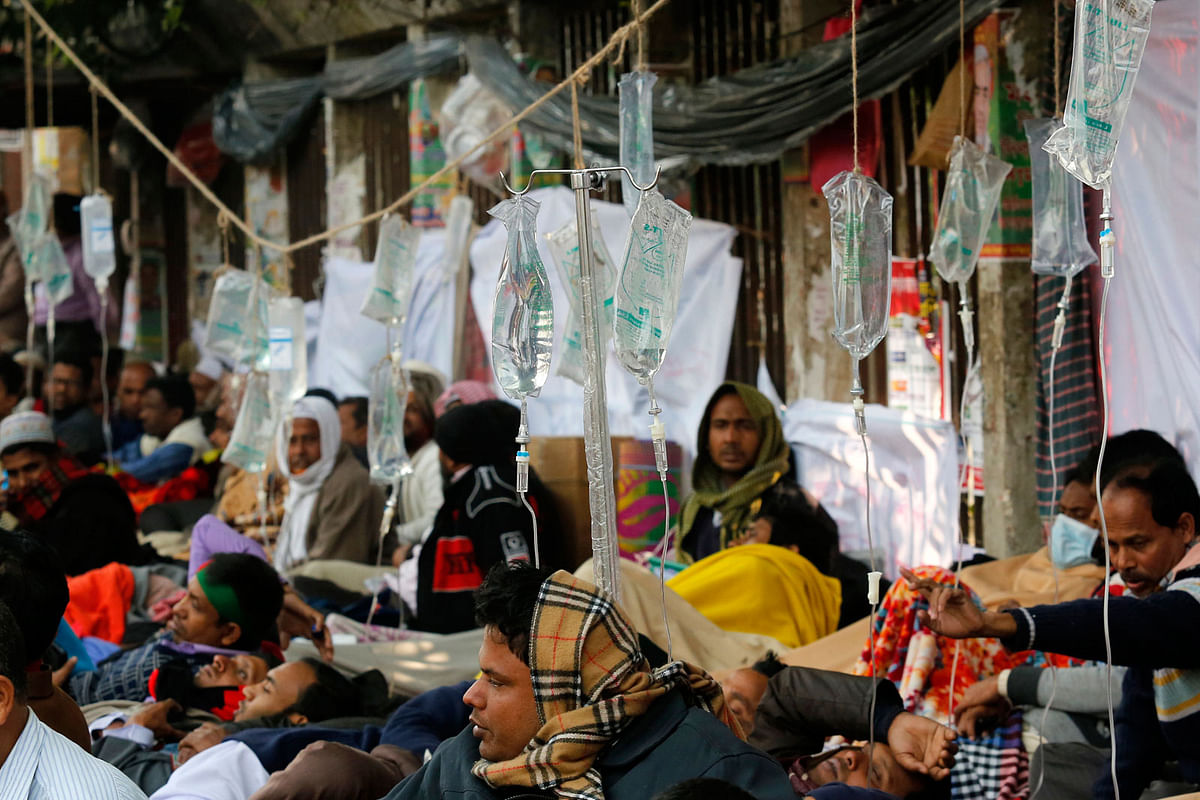 Teachers are administered intravenous saline during their programme of indefinite hunger strike at the Jatiya Press Club on 4 January, demanding disparity in wages to be lessened. Photo : Hasan Raja