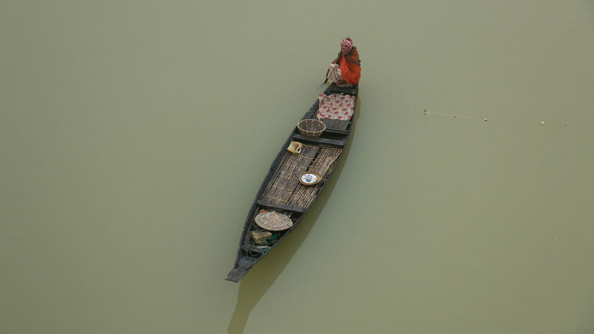 A man fishes in a cold winter morning at Changer Khal river in Badaghat, Sylhet on 6 January. Photo: Anis Mahmud
