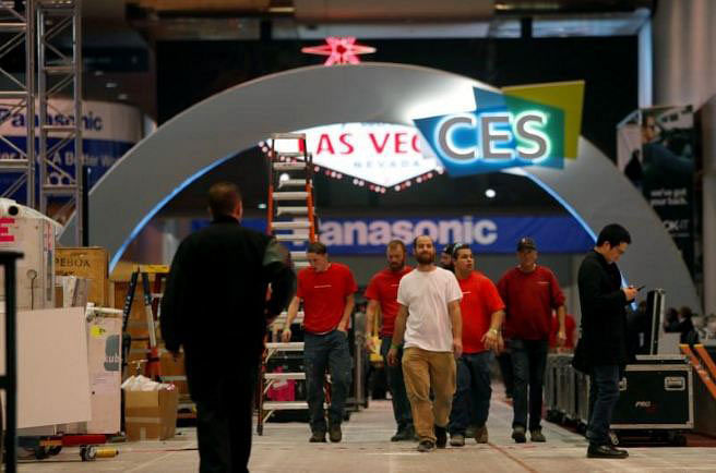 Workers walk through Las Vegas Convention Center lobby as they prepare for the 2018 CES in Las Vegas, Nevada, US on 5 January 2018. Reuters