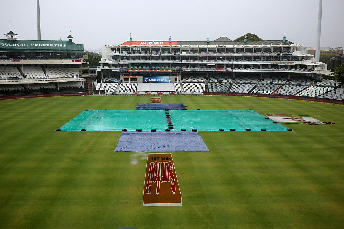 Covers are seen at Newlands Stadium, Cape Town, South Africa on 7 January 2018. Later, umpires were forced to call off the third day`s play of the first Test cricket match between India and South Africa due to rain. Reuters