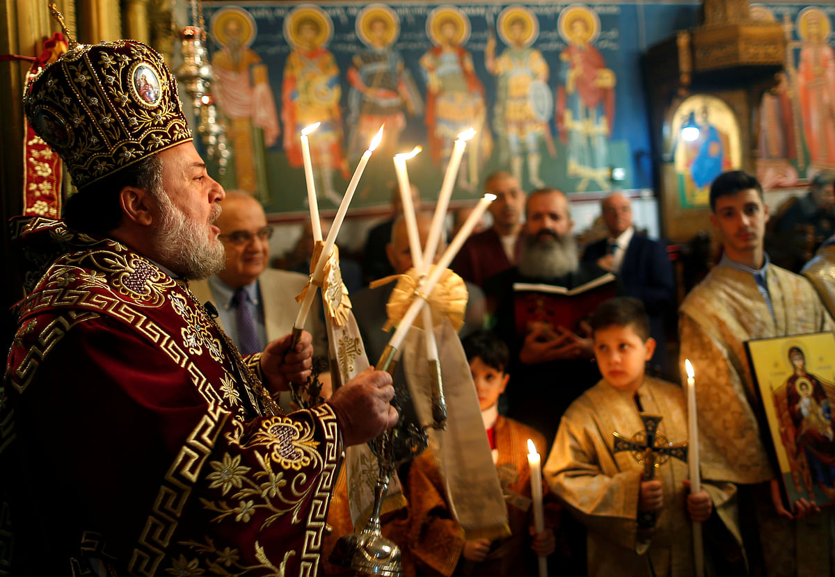 Greek Orthodox Archbishop Alexios holds an Orthodox Christmas mass at the Saint Porfirios church in Gaza City on 7 January 2018. Photo: Reuters