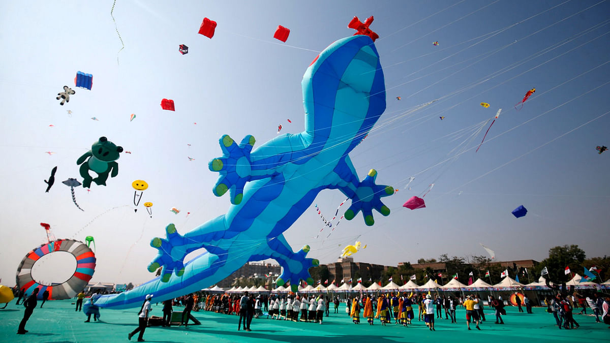 Kite-flying enthusiasts fly kites on the first day of the eight-day-long International Kite Festival in Ahmedabad, India, on 7 January. Photo: Reuters