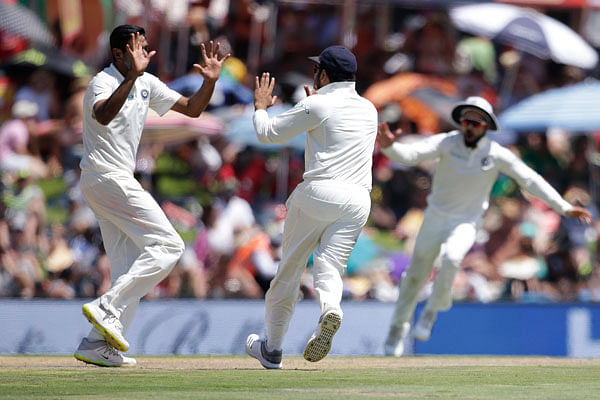 India’s bowler Ravichandran Ashwin (L) celebrates the dismissal of South Africa’s Aiden Markram (not in picture) during the first day of the second Test cricket match between South Africa and India at Supersport cricket ground on Saturday. Photo: AFP