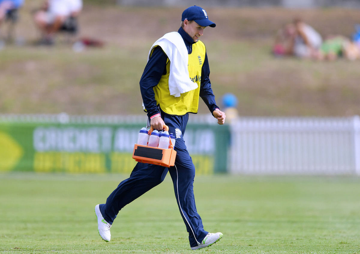 England`s Joe Root runs off the pitch carrying water bottles during a limited overs tour match against a Cricket Australia XI team at Drummoyne Oval in Sydney, Australia on 11 January 2018. Reuters