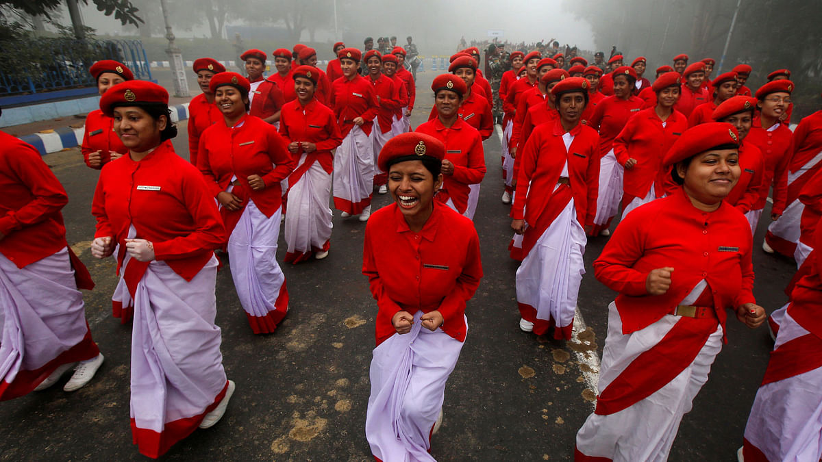 Indian civil defence personnel laugh before they start their rehearsals for the Republic Day parade on a winter morning in Kolkata, India on 15 January 2018. Photo: Reuters